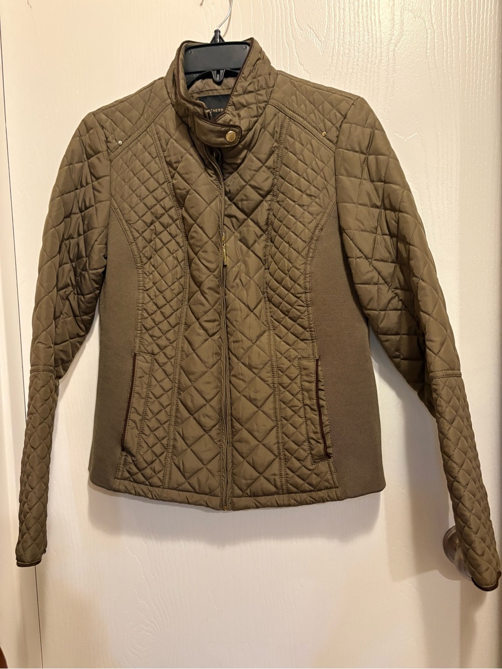 Nice new fitted jacket with two front pockets. Size small.